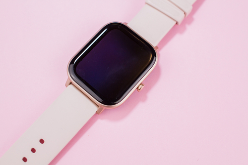 Women,Smart,Watch,On,A,Pink,Background