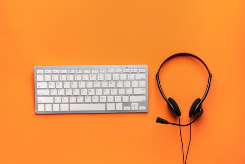 Headset,With,Computer,Keyboard,On,Color,Background
